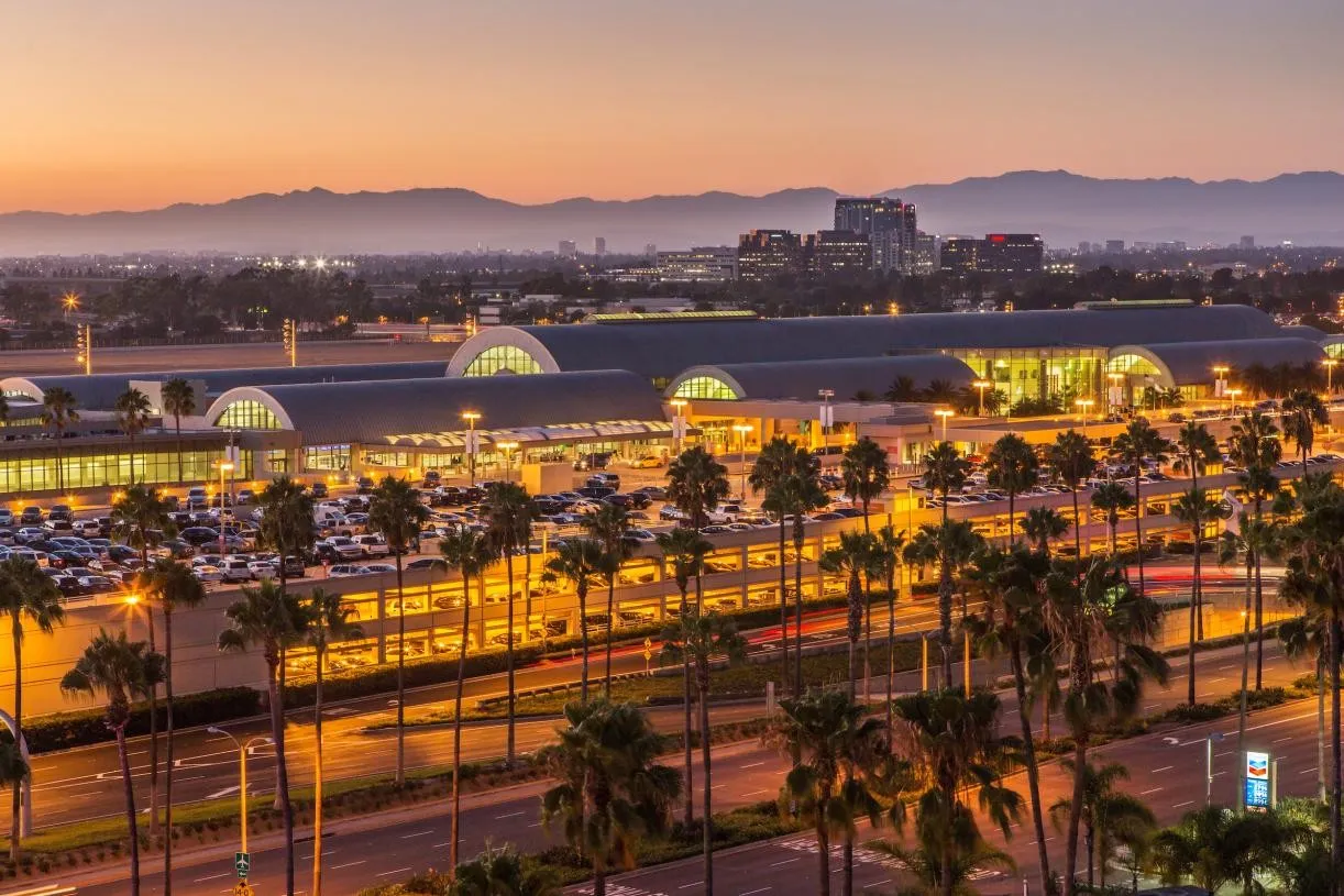 John Wayne Airport terminal exterior at sunset